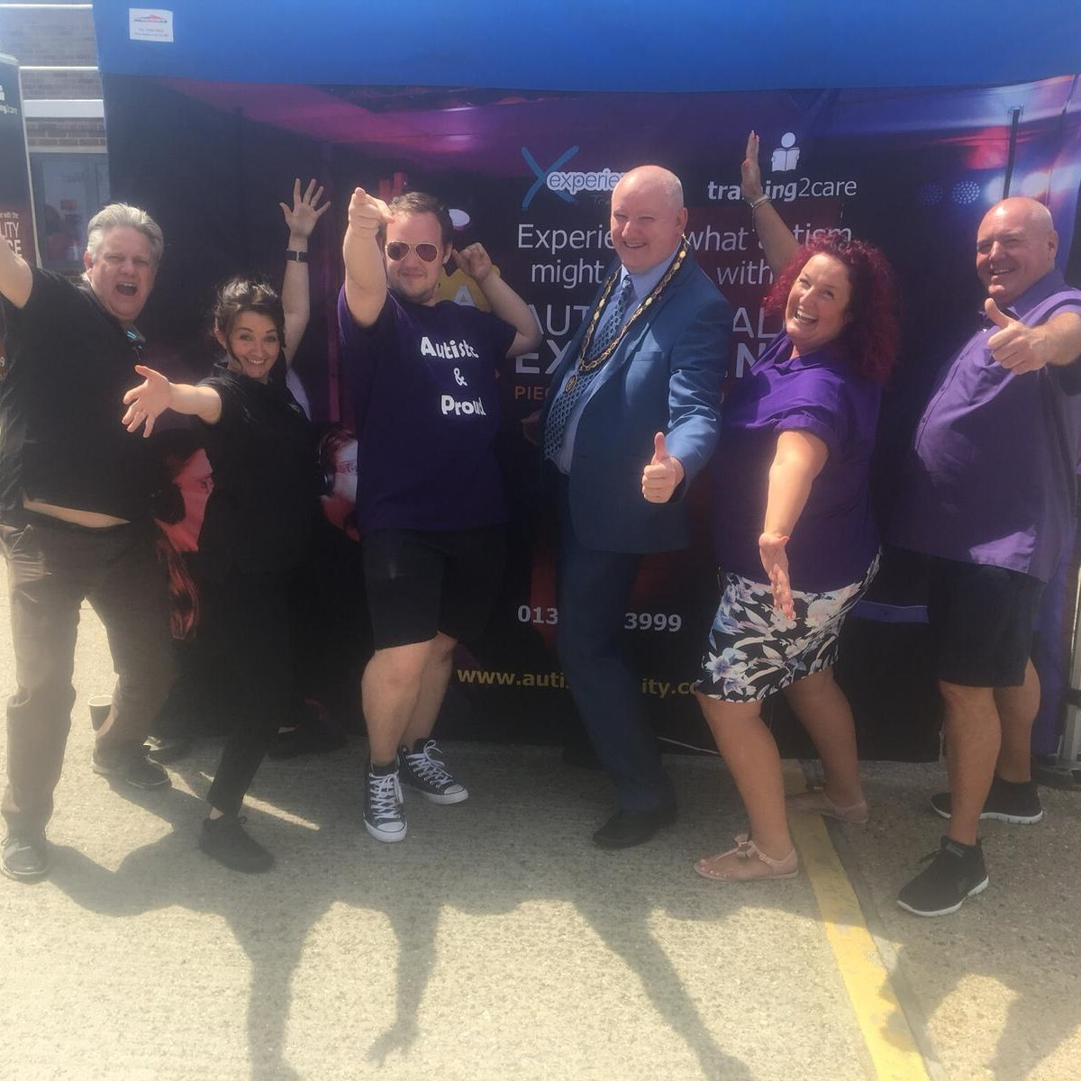 Team members with the autism reality experience bus